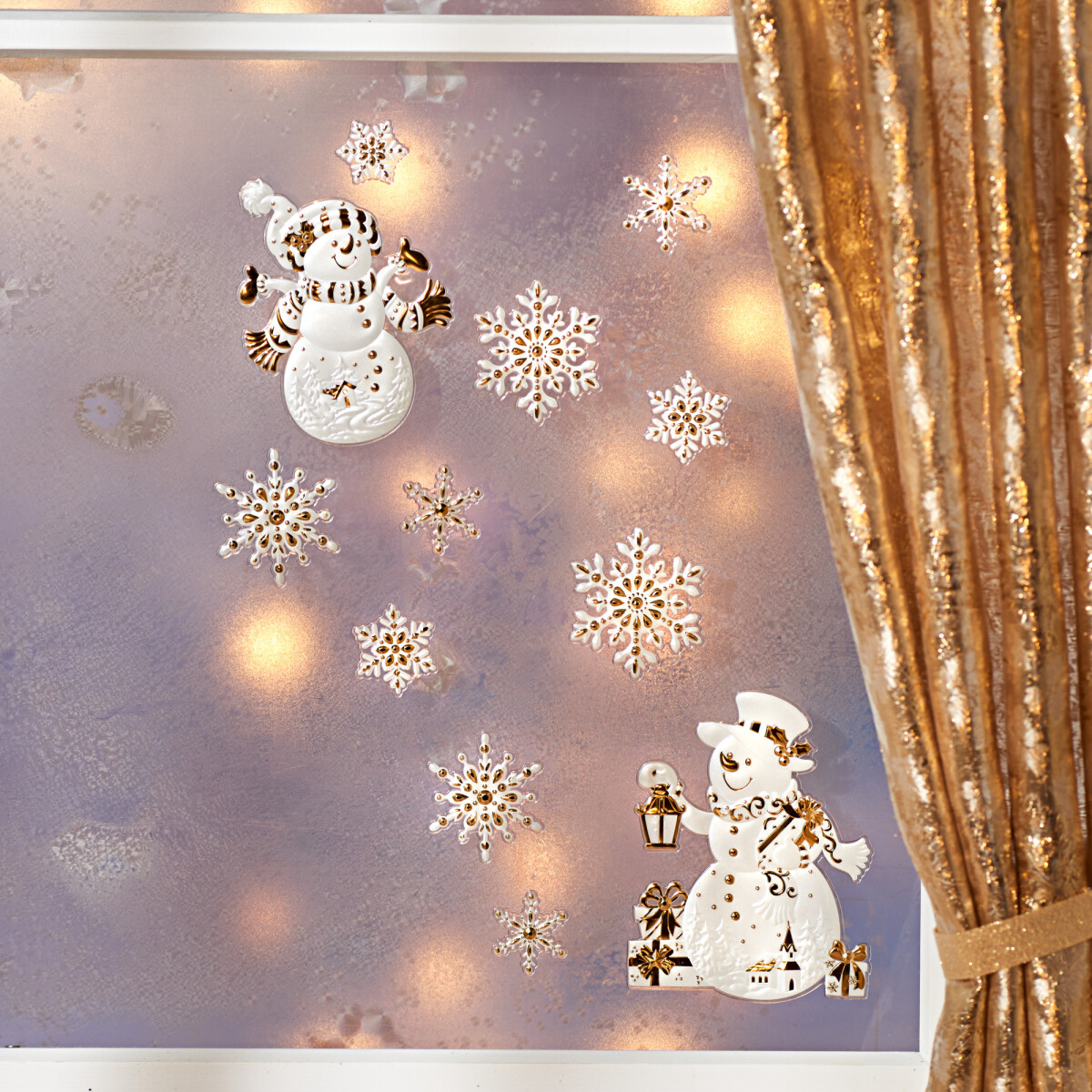 Levně 10dílný obraz na okno "Zlatí sněhuláci"
