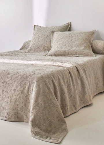 Žakárový přehoz na postel s vaflovým vzorem a potiskem listů