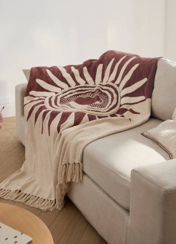 Pléd s texturovaným efektem a motivem slunce