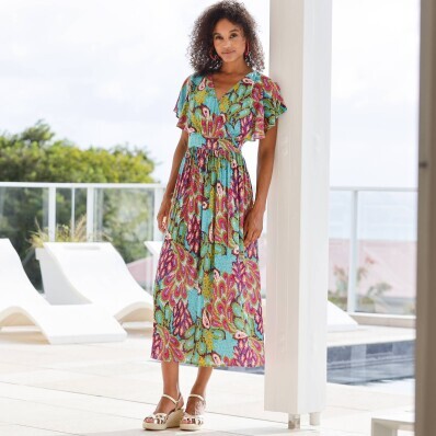 Kreponowa sukienka midi z dekoltem na krzyż i nadrukiem